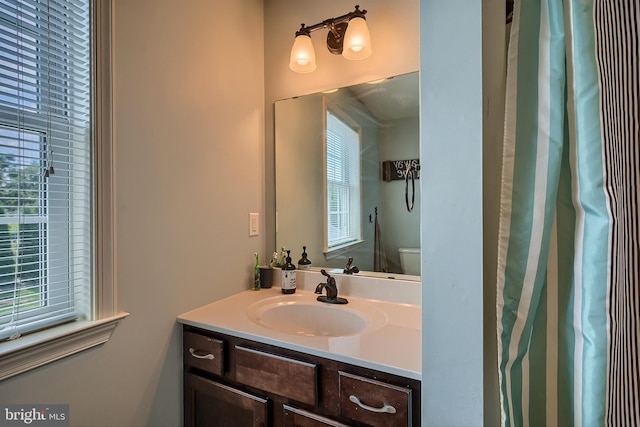 bathroom with vanity and toilet