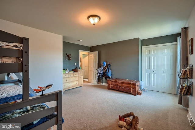 carpeted bedroom featuring a closet