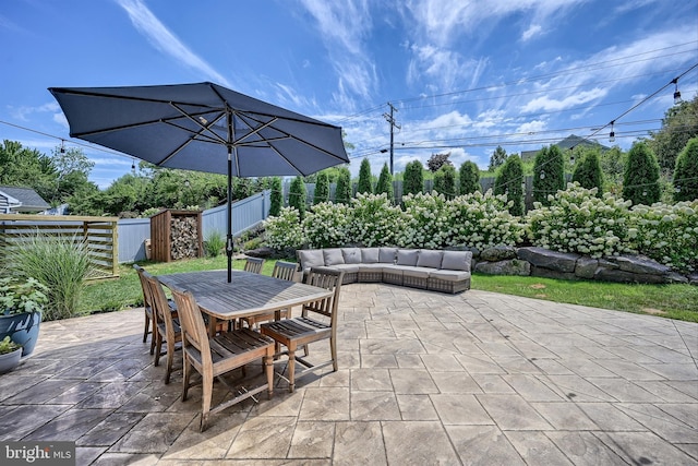 view of patio / terrace featuring outdoor lounge area, outdoor dining area, and a fenced backyard