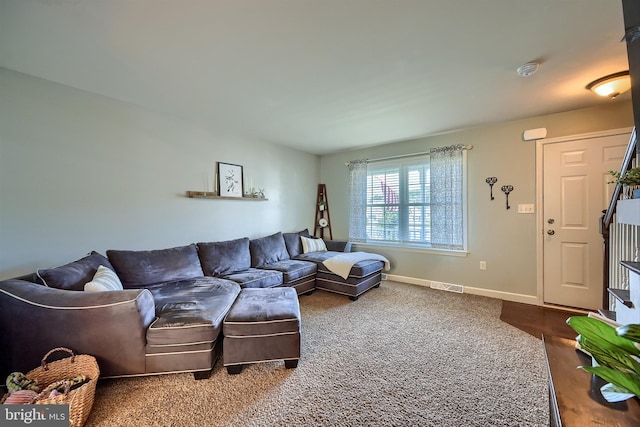 living room with visible vents and baseboards