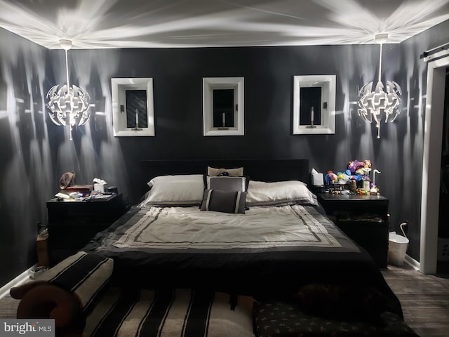 bedroom featuring wood finished floors