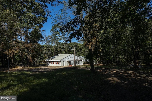 exterior space featuring a front lawn