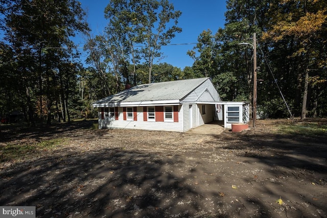 view of front of property with metal roof