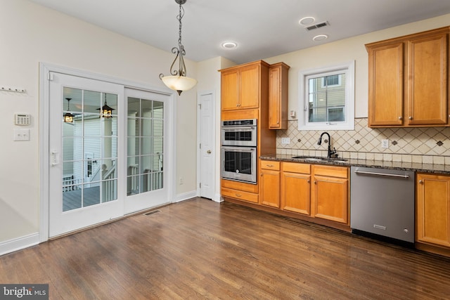 9 Quaker St, Chesterfield, NJ 08515 - kitchen with dark wood-style flooring, decorative backsplash, a sink, visible vents, and appliances with stainless steel finishes