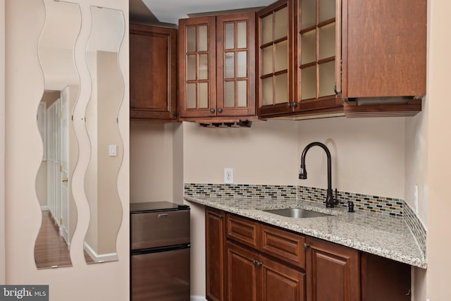 9 Quaker St, Chesterfield, NJ 08515 - kitchen with glass insert cabinets, light stone counters, a sink, and tasteful backsplash