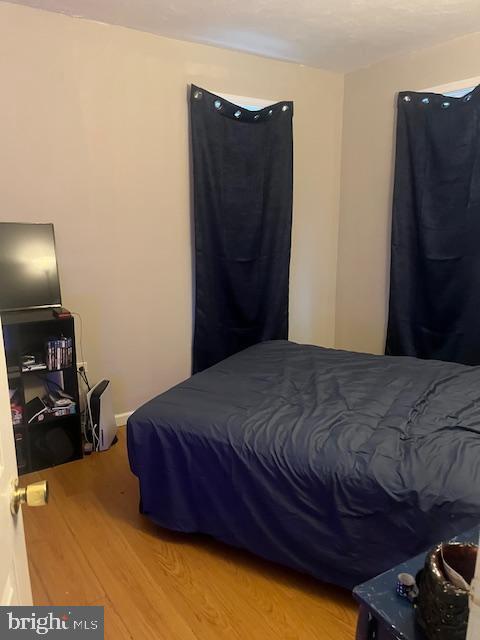 bedroom featuring wood finished floors