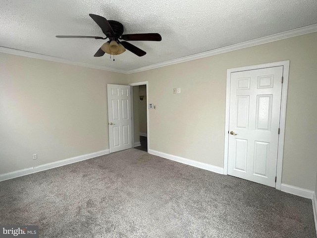 unfurnished bedroom with a textured ceiling, carpet floors, and ornamental molding