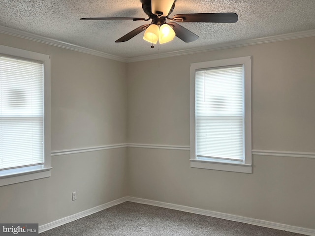 empty room with a wealth of natural light, a textured ceiling, ceiling fan, and crown molding