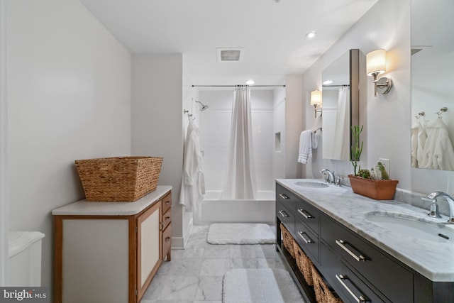 full bathroom featuring a sink, visible vents, marble finish floor, and double vanity