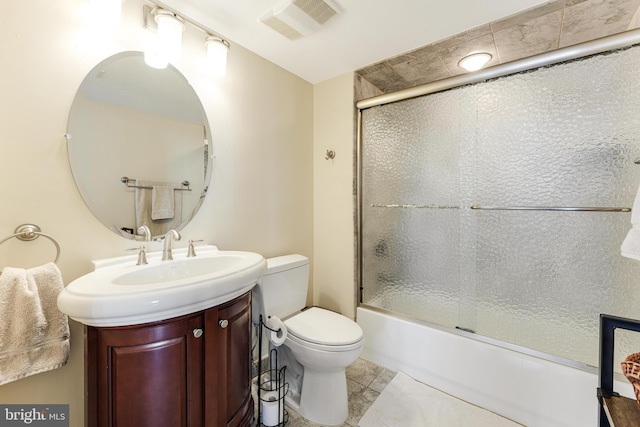 full bathroom featuring visible vents, enclosed tub / shower combo, toilet, and vanity