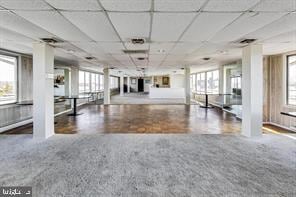 miscellaneous room with a paneled ceiling