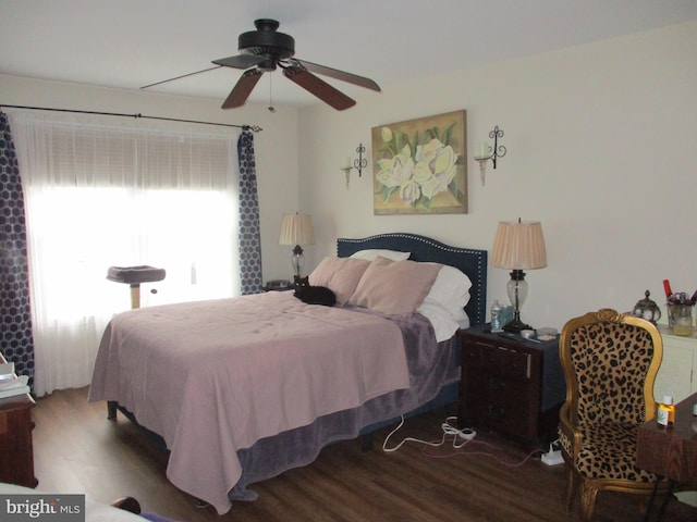 bedroom featuring a ceiling fan and wood finished floors