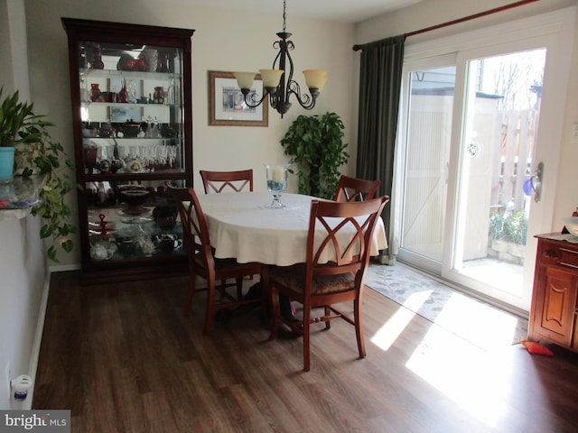 dining room featuring an inviting chandelier and wood finished floors