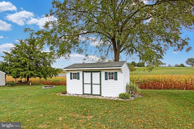 view of shed with a fire pit