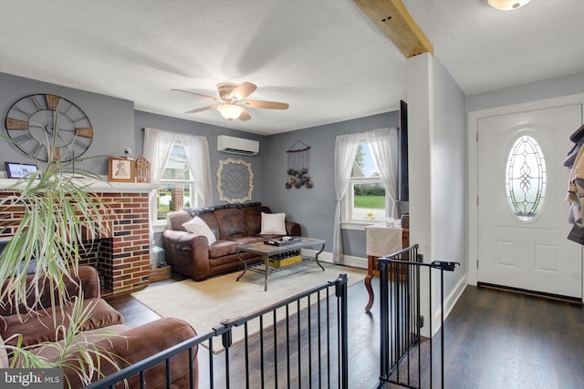 foyer entrance featuring wood finished floors, baseboards, a wealth of natural light, and a wall mounted AC