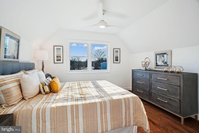 bedroom featuring a ceiling fan, dark wood-type flooring, and lofted ceiling