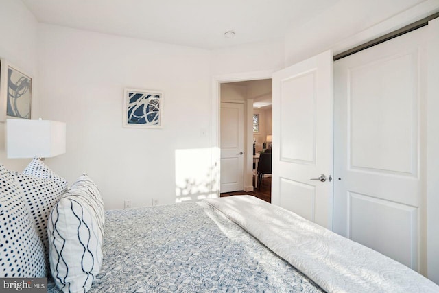 bedroom with a closet and wood finished floors