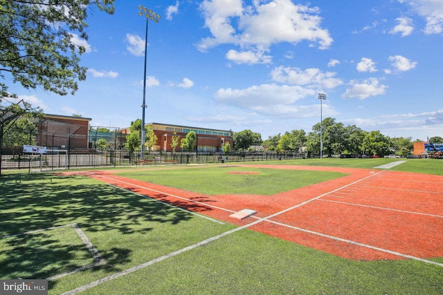 view of sport court featuring fence