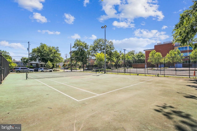 view of sport court with fence