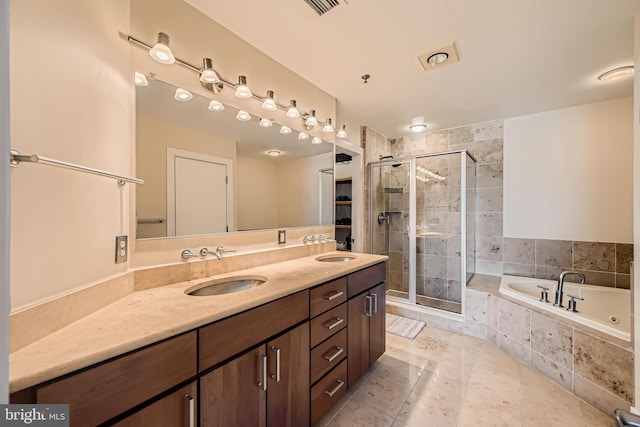 full bath featuring a sink, double vanity, a bath, and a shower stall