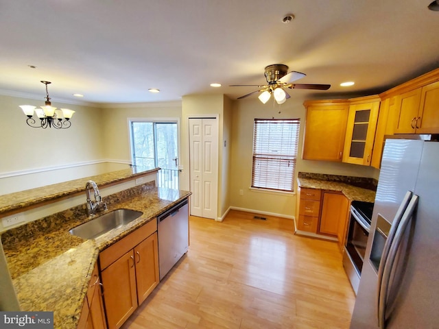 kitchen featuring a sink, brown cabinets, and appliances with stainless steel finishes