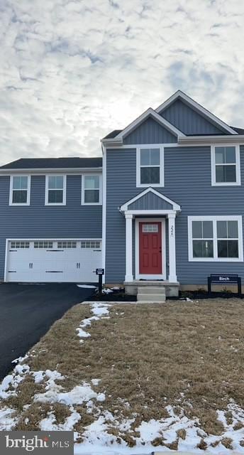 view of front of house with driveway and a garage