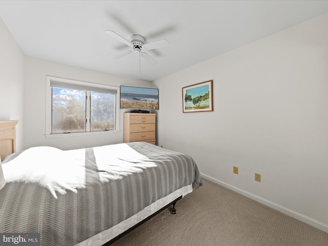 bedroom featuring a ceiling fan, baseboards, and carpet floors