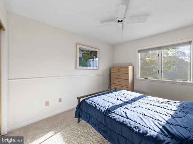 bedroom featuring baseboards, carpet, and ceiling fan