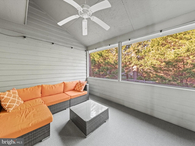 sunroom / solarium with ceiling fan and vaulted ceiling