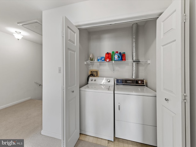 laundry area featuring light carpet, separate washer and dryer, attic access, and laundry area