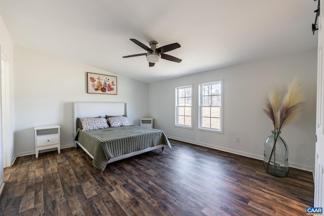 bedroom featuring baseboards, lofted ceiling, ceiling fan, and dark wood-style flooring