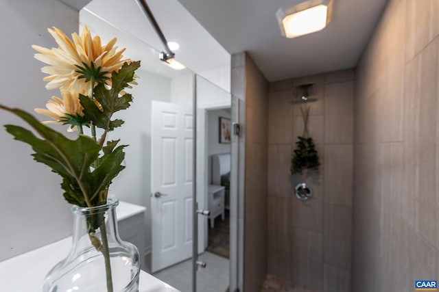 bathroom with tiled shower