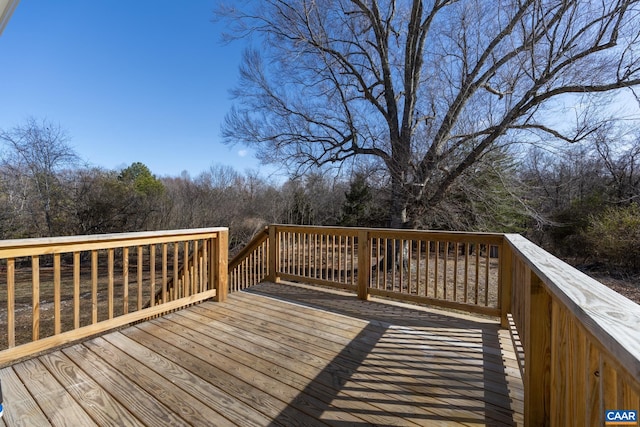 deck featuring a view of trees