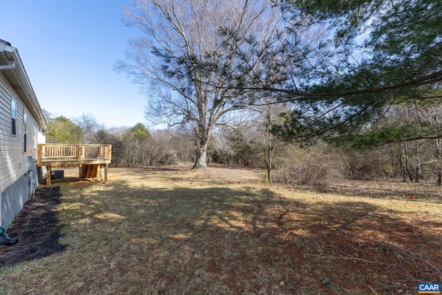 view of yard with a wooden deck