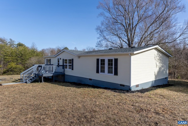 view of front of home featuring stairway, roof with shingles, a wooden deck, a front lawn, and crawl space