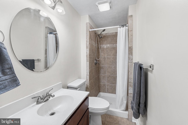 bathroom with visible vents, toilet, a stall shower, tile patterned floors, and vanity