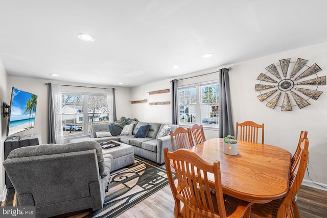 dining space with recessed lighting and wood finished floors