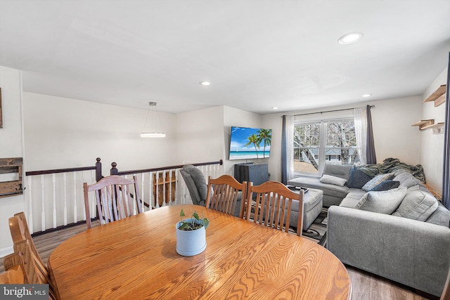 dining space with recessed lighting and wood finished floors