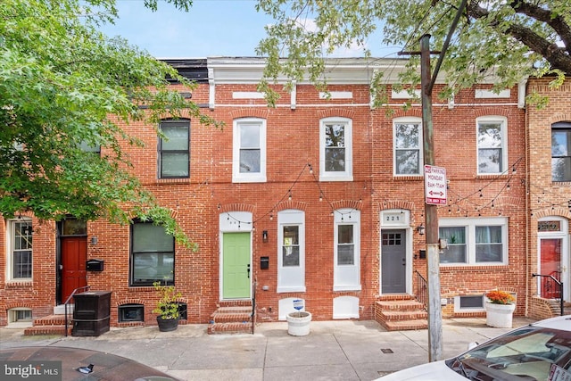 multi unit property with brick siding and entry steps