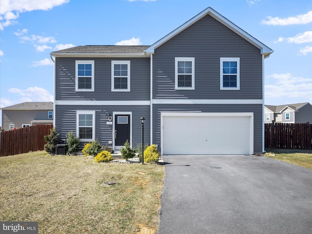 view of front of property featuring a front yard, an attached garage, fence, and aphalt driveway