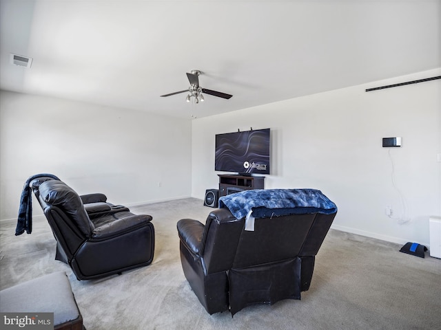 carpeted living area with visible vents, a ceiling fan, and baseboards