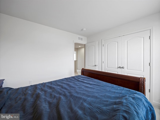 carpeted bedroom with visible vents