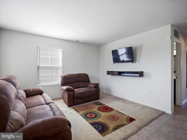 living room featuring visible vents and baseboards