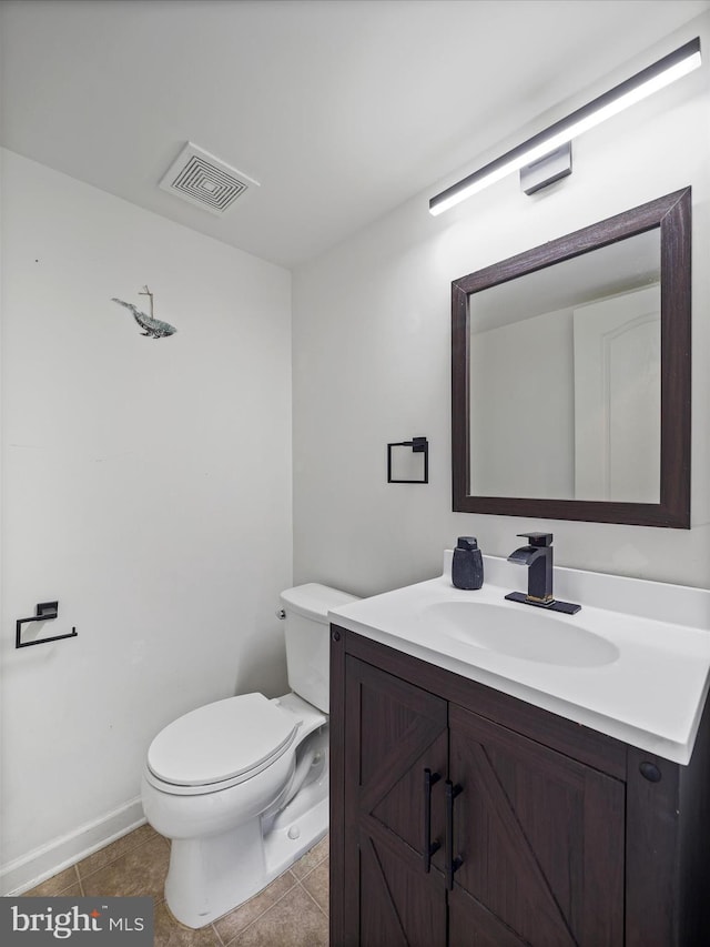 half bathroom with tile patterned floors, visible vents, toilet, and vanity