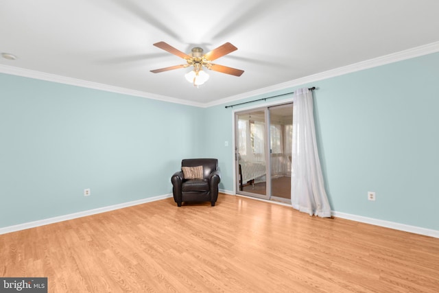 unfurnished room with baseboards, wood finished floors, and crown molding