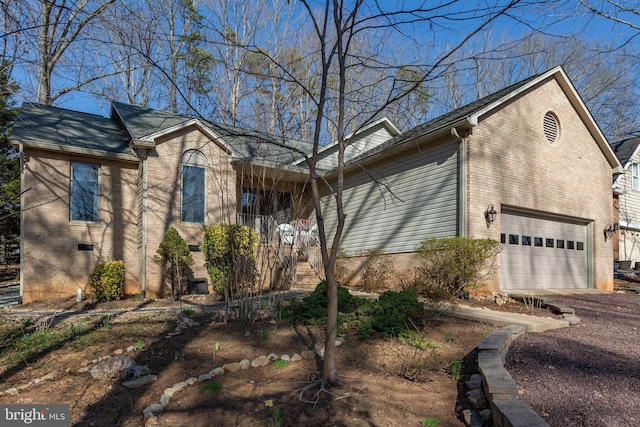 view of front of home with brick siding and driveway