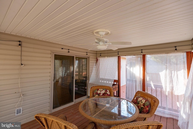 sunroom with visible vents and ceiling fan