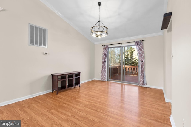 empty room featuring crown molding, baseboards, visible vents, and light wood-type flooring