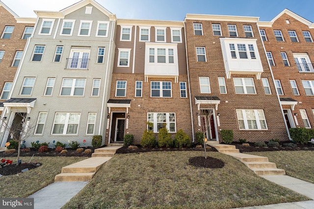 multi unit property featuring brick siding