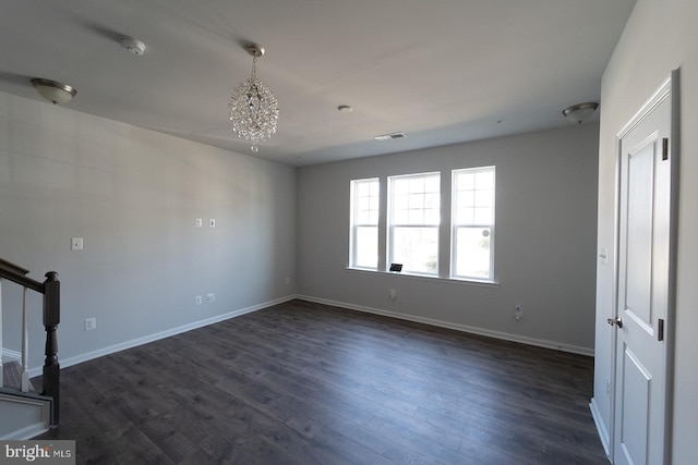 unfurnished living room with dark wood-type flooring, baseboards, and visible vents